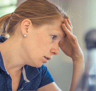 Woman Sitting in Front of the Laptop Computer in Shallow Photo